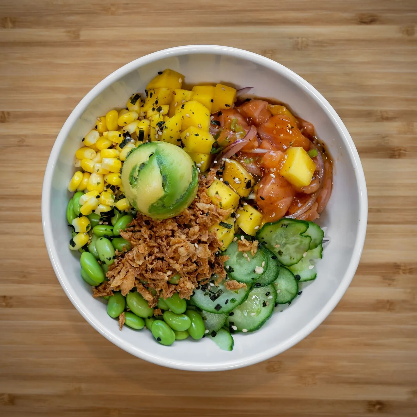 Honu Lulu: yuzu salmon poke with mango, avocado, corn, edamame, cucumber and crispy onion